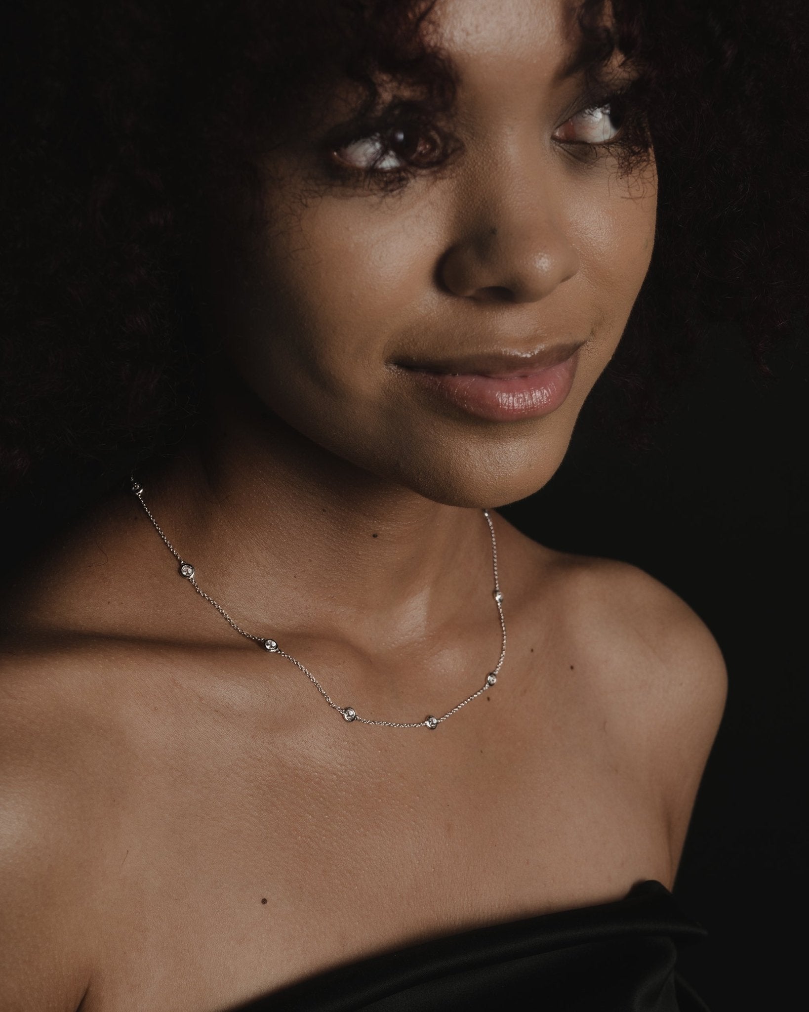 Isa Necklace with 11 bezel-set round simulated diamonds on a delicate sterling silver chain