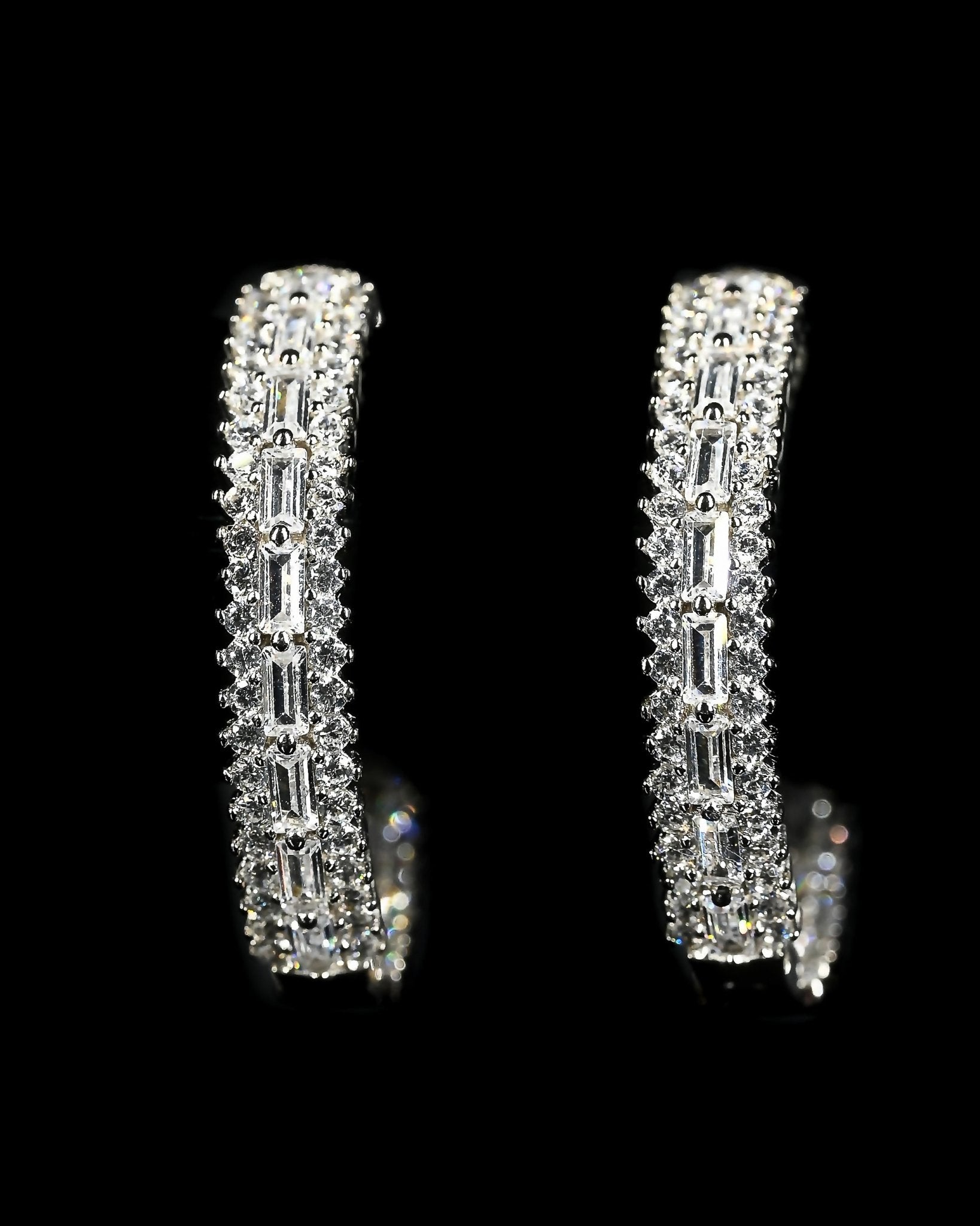 Marzi Huggie Hoop Earrings with emerald and round cut simulated diamonds set in polished sterling silver